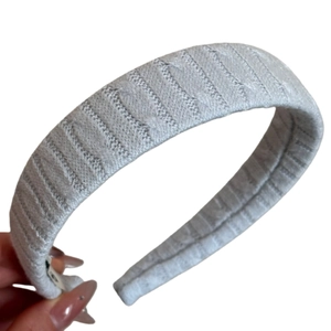 Vintage light grey knit headband with thick cable texture and wide padded design