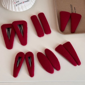 Elegant red felt hair clips set in geometric shapes for a festive New Year hair accessory