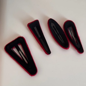 Detailed back view of four-piece red velvet hair clip set with sturdy metal spring clasps
