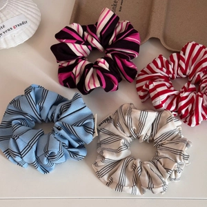 Set of four colorful striped oversized scrunchies in stylish knitted cotton fabric
