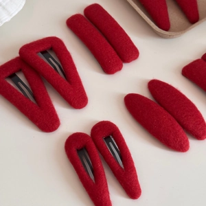 Elegant red felt fabric hair clips set with geometric shapes for festive styling