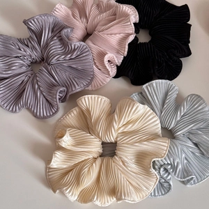 Set of five large pleated scrunchies in gray, pink, black, champagne, and light blue