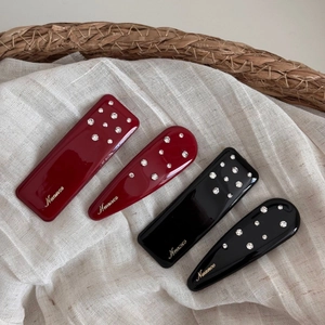 Elegant rhinestone hair clips in wine red and black, set of four with gold lettering