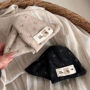Floral baby knit beanie in beige and dark gray with cute bear patch in a soft setting