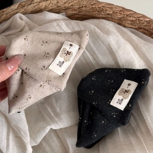 Chic floral print hair claw clips in beige and dark grey for elegant bun hairstyles
