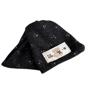 Dark grey knitted beanie featuring floral patterns and a cute bear design patch