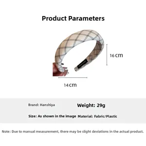 Detail view of black and white plaid headband showing dimensions and handmade label