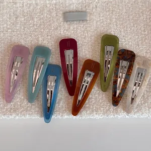Set of 8 colorful acetate teardrop hair clips in various marble and tortoiseshell patterns