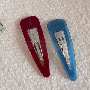 Detail of colorful acetate hair clips with France Handmade gold lettering and metal grip