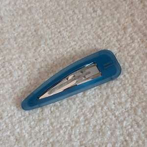 Detail of blue acetate hair clip with silver metal clip and gold FRANCE Handmade lettering