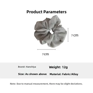 Polka dot mesh scrunchie detail showing 7cm diameter and white fabric texture