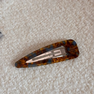 Macro detail of tortoiseshell acetate hair clip with France Handmade engraving