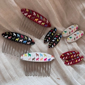 Hair comb and clip set with colorful Dala Horse patterns in red, black, and ivory white