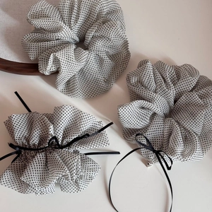 Polka dot mesh scrunchies with black ribbons and silver heart pendants in a set