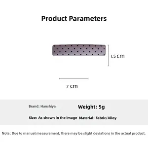 Detail showing purple polka dot fabric hair clip with size dimensions 7cm by 1.5cm