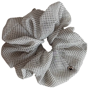 Elegant polka dot chiffon hair scrunchie in white with heart pendant detail