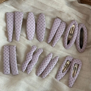 16-piece set of purple polka dot fabric snap hair clips in assorted geometric shapes