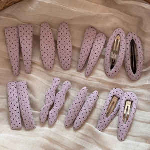 Set of 16 purple polka dot fabric hair clips in various geometric shapes for women
