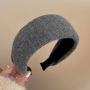 Detail of grey wide striped headband with wool texture and non-slip fabric lining