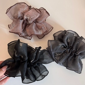 Three-piece set of sheer gauze scrunchies with glitter edges in pink, grey, and black
