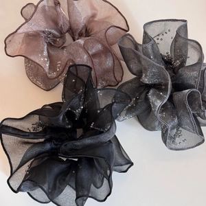 Three oversized sheer scrunchies with glitter sequins in pink-brown, grey and black