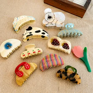Variety of acetic acid hair clips featuring koala, strawberry and floral patterns
