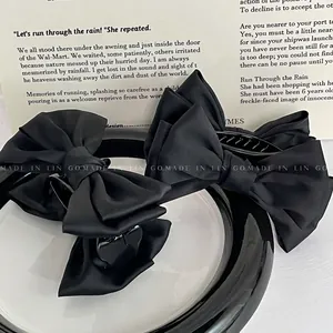 Grande pince à cheveux élégante en satin noir avec nœud papillon pour queue de cheval haute