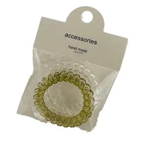 Two-piece set of transparent jelly colored spiral telephone wire hair coils with packaging