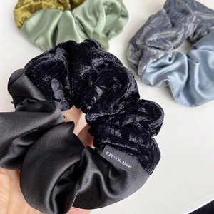 Detail of French velvet and satin scrunchie with a Made in Korea woven label