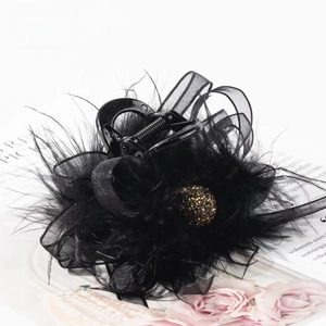 Elegant black feather hair claw with mesh bow and crystal ball for formal events