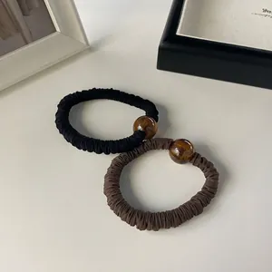 Elegant pleated hair ties set in black and coffee with amber resin beads decoration