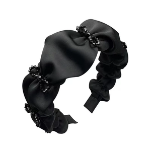 Elegant black satin pleated headband with sparkling crystal beaded rings on white background