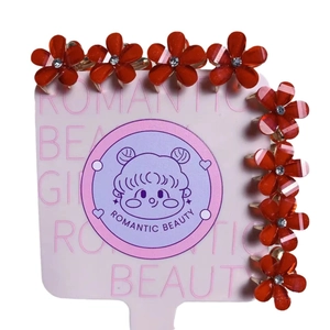 Lot de 8 pinces à cheveux fleurs rouges avec strass sur carte de présentation