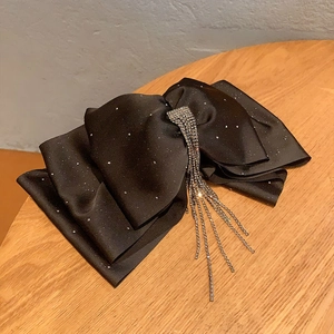 Elegant black satin bow hair claw clip with rhinestones and long tassel streamers