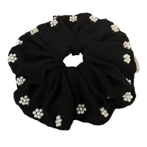 Elegant black large scrunchie with glitter fabric and pearl flower charms for hair styling