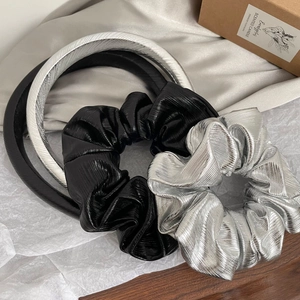 Minimalist silver and black pleated headband and scrunchie set with metallic texture