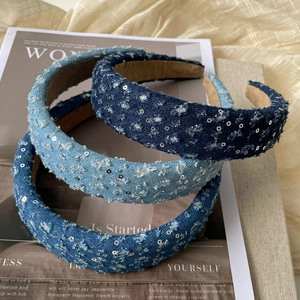 Detailed view of three-piece denim padded headbands with frayed edges and silver sequins