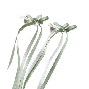 Sweet ballet style green and white ribbon bow hair clips with long cascading tassels