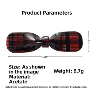 Macro view of red and black plaid acetate bow hair clip with size and weight details