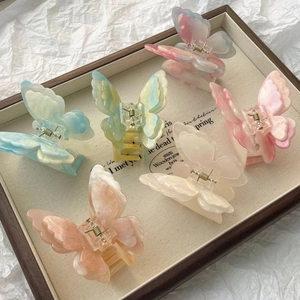Collection de pinces à cheveux papillon aux couleurs pastel dégradé marbré