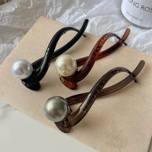 Three-piece vintage twisted pearl hair clips in black, brown, and translucent grey