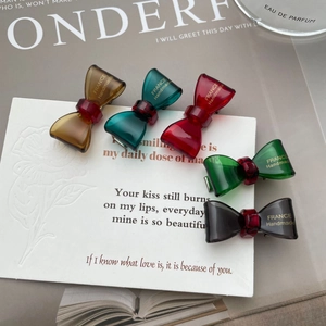 Translucent acetate bow hair clips in five colors with golden France handmade text