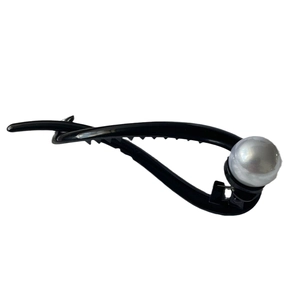 Elegant vintage black twist hair clip with a large white pearl accent for women