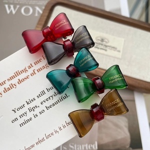 Chic acetate bow hair clips in multiple colors with elegant gold label handmade finish