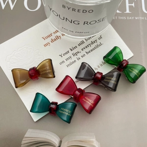 Five-piece set of elegant acetate bow hair clips in assorted rich translucent colors
