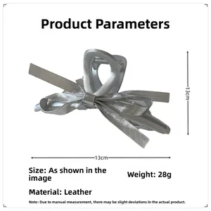 Detail showing dimensions and silver leather bow hair claw clip weight at 28g