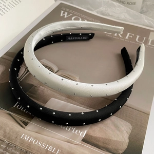 Elegant set of black and beige satin headbands with shimmering diamond stud details