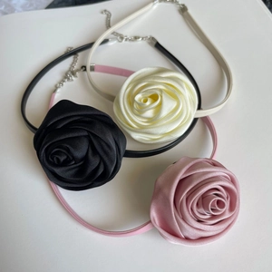Three elegant fabric rose chokers in black cream and pink with adjustable lobster clasps
