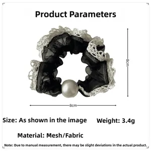 Detail view of black mesh lace hair scrunchie with white pearl ornament and size guide