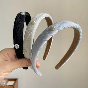 Three-piece vintage headband set with pearl flowers and textured tweed fabric in black and white